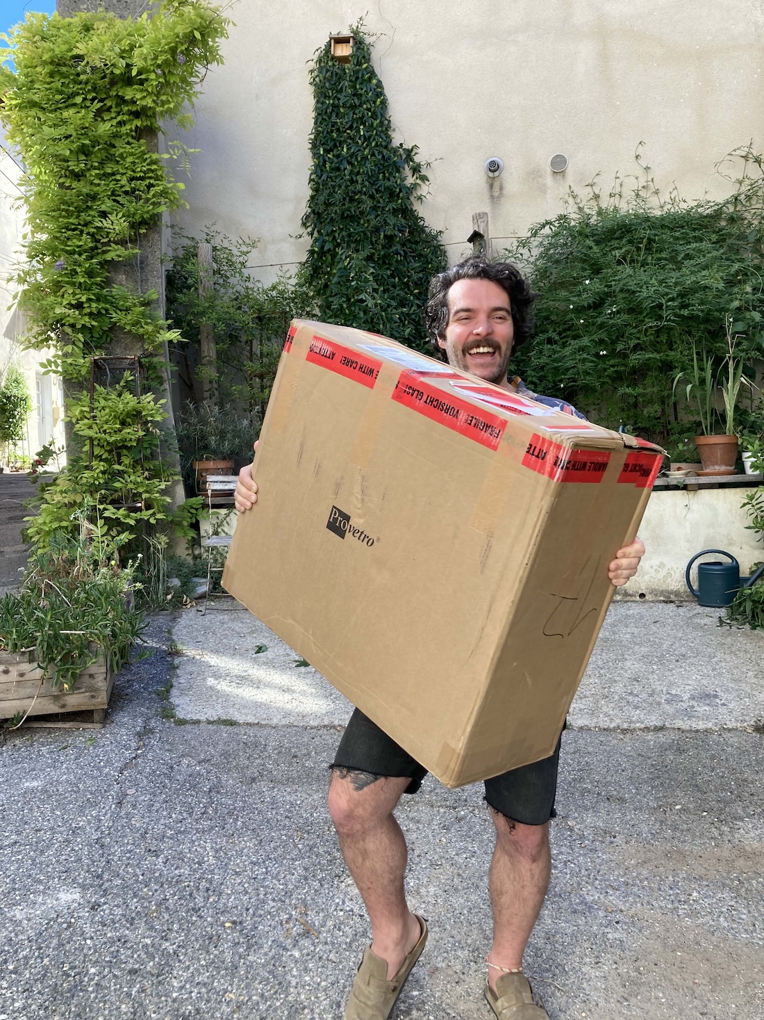 a picture of Remi Mercier carrying a package