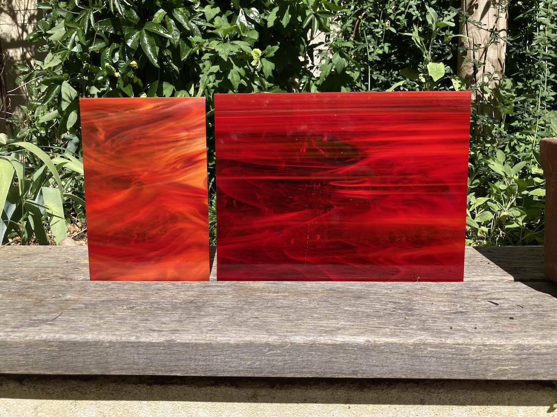 two sheets of red glass in the sun