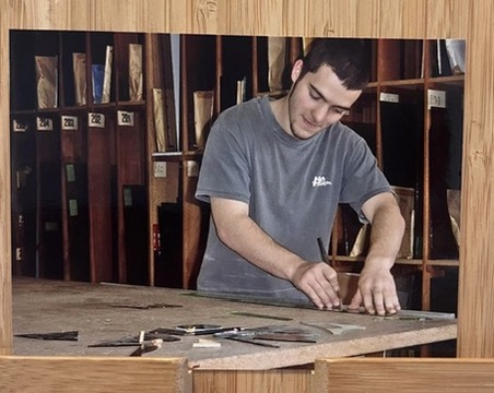 me, around age 19, cutting some glass in a workshop