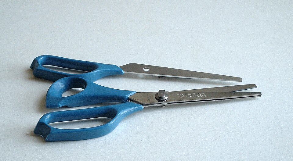 a pair of three-bladed scissors